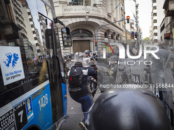 Protesters, including retirees and families, gather outside Argentina's National Congress following President Javier Milei's veto of the Mob...