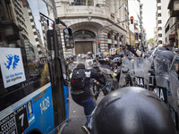 Protesters, including retirees and families, gather outside Argentina's National Congress following President Javier Milei's veto of the Mob...