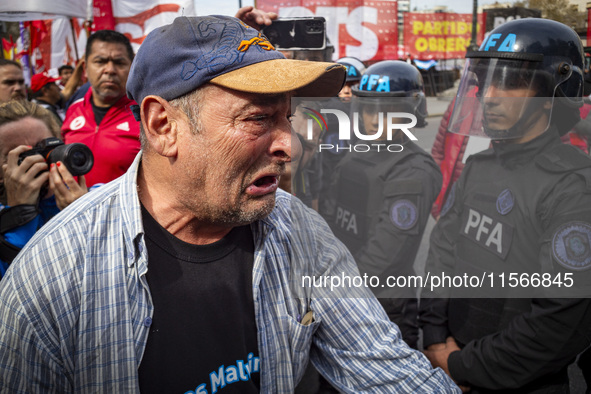 Protesters, including retirees and families, gather outside Argentina's National Congress following President Javier Milei's veto of the Mob...