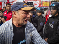 Protesters, including retirees and families, gather outside Argentina's National Congress following President Javier Milei's veto of the Mob...