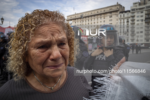 Protesters, including retirees and families, gather outside Argentina's National Congress following President Javier Milei's veto of the Mob...