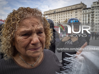 Protesters, including retirees and families, gather outside Argentina's National Congress following President Javier Milei's veto of the Mob...