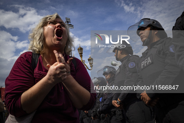 Protesters, including retirees and families, gather outside Argentina's National Congress following President Javier Milei's veto of the Mob...