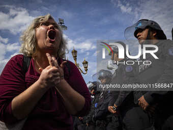 Protesters, including retirees and families, gather outside Argentina's National Congress following President Javier Milei's veto of the Mob...