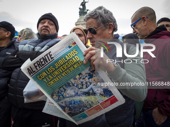 Protesters, including retirees and families, gather outside Argentina's National Congress following President Javier Milei's veto of the Mob...