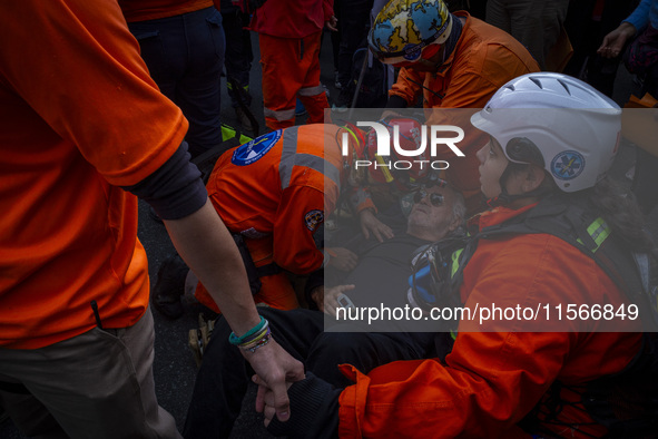 Protesters, including retirees and families, gather outside Argentina's National Congress following President Javier Milei's veto of the Mob...