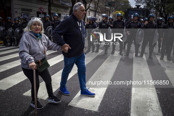 Protesters, including retirees and families, gather outside Argentina's National Congress following President Javier Milei's veto of the Mob...