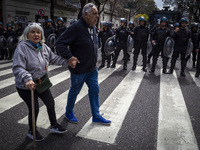 Protesters, including retirees and families, gather outside Argentina's National Congress following President Javier Milei's veto of the Mob...