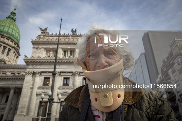 Protesters, including retirees and families, gather outside Argentina's National Congress following President Javier Milei's veto of the Mob...