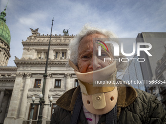 Protesters, including retirees and families, gather outside Argentina's National Congress following President Javier Milei's veto of the Mob...