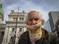 Protesters, including retirees and families, gather outside Argentina's National Congress following President Javier Milei's veto of the Mob...