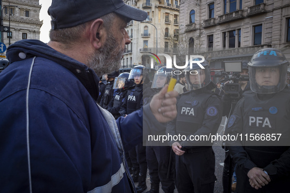 Protesters, including retirees and families, gather outside Argentina's National Congress following President Javier Milei's veto of the Mob...