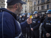 Protesters, including retirees and families, gather outside Argentina's National Congress following President Javier Milei's veto of the Mob...