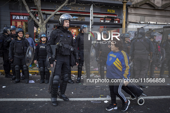 Protesters, including retirees and families, gather outside Argentina's National Congress following President Javier Milei's veto of the Mob...