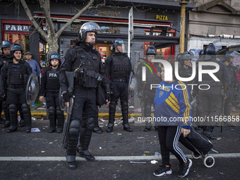 Protesters, including retirees and families, gather outside Argentina's National Congress following President Javier Milei's veto of the Mob...