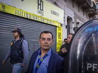 Protesters, including retirees and families, gather outside Argentina's National Congress following President Javier Milei's veto of the Mob...