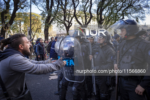 Protesters, including retirees and families, gather outside Argentina's National Congress following President Javier Milei's veto of the Mob...