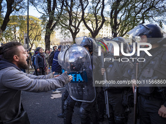 Protesters, including retirees and families, gather outside Argentina's National Congress following President Javier Milei's veto of the Mob...