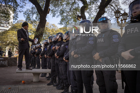 Protesters, including retirees and families, gather outside Argentina's National Congress following President Javier Milei's veto of the Mob...