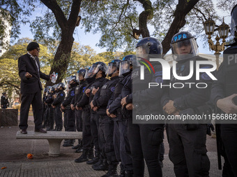 Protesters, including retirees and families, gather outside Argentina's National Congress following President Javier Milei's veto of the Mob...