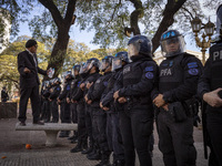 Protesters, including retirees and families, gather outside Argentina's National Congress following President Javier Milei's veto of the Mob...