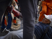 Protesters, including retirees and families, gather outside Argentina's National Congress following President Javier Milei's veto of the Mob...