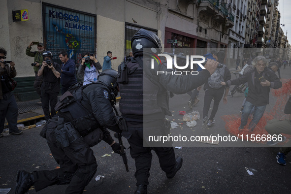 Protesters, including retirees and families, gather outside Argentina's National Congress following President Javier Milei's veto of the Mob...