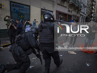 Protesters, including retirees and families, gather outside Argentina's National Congress following President Javier Milei's veto of the Mob...