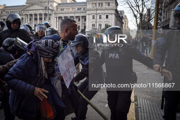 Protesters, including retirees and families, gather outside Argentina's National Congress following President Javier Milei's veto of the Mob...