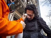 Protesters, including retirees and families, gather outside Argentina's National Congress following President Javier Milei's veto of the Mob...