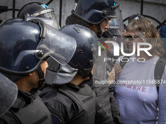 Protesters, including retirees and families, gather outside Argentina's National Congress following President Javier Milei's veto of the Mob...