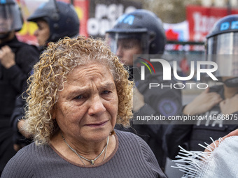 Protesters, including retirees and families, gather outside Argentina's National Congress following President Javier Milei's veto of the Mob...