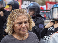 Protesters, including retirees and families, gather outside Argentina's National Congress following President Javier Milei's veto of the Mob...