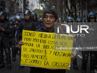 Protesters, including retirees and families, gather outside Argentina's National Congress following President Javier Milei's veto of the Mob...