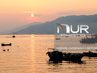 Workers work in a breeding area at a marine ranch in Dinghai Bay, Lianjiang County in Fuzhou, China, on September 10, 2024. (