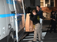 Crime scene investigators collect evidence at the scene where a man is killed by a shot to the head in Queens, New York, on September 11, 20...