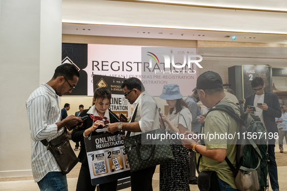 Visitors and exhibitors attend the 70th gems and jewelry fair in Bangkok, Thailand. The trade show is one of the most important events of it...