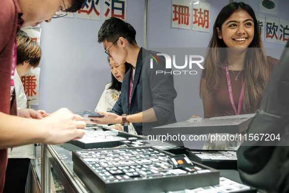 Visitors and exhibitors attend the 70th gems and jewelry fair in Bangkok, Thailand. The trade show is one of the most important events of it...