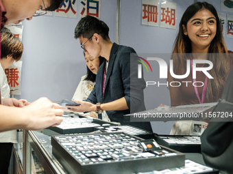 Visitors and exhibitors attend the 70th gems and jewelry fair in Bangkok, Thailand. The trade show is one of the most important events of it...