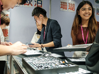 Visitors and exhibitors attend the 70th gems and jewelry fair in Bangkok, Thailand. The trade show is one of the most important events of it...