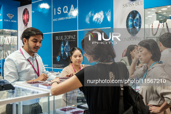 Visitors and exhibitors attend the 70th gems and jewelry fair in Bangkok, Thailand. The trade show is one of the most important events of it...