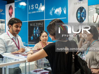 Visitors and exhibitors attend the 70th gems and jewelry fair in Bangkok, Thailand. The trade show is one of the most important events of it...