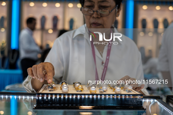 Visitors and exhibitors attend the 70th gems and jewelry fair in Bangkok, Thailand. The trade show is one of the most important events of it...