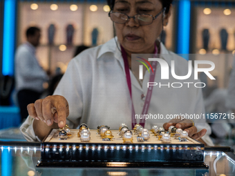 Visitors and exhibitors attend the 70th gems and jewelry fair in Bangkok, Thailand. The trade show is one of the most important events of it...