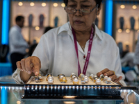 Visitors and exhibitors attend the 70th gems and jewelry fair in Bangkok, Thailand. The trade show is one of the most important events of it...