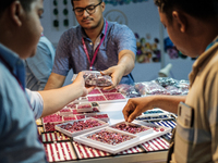 Visitors and exhibitors attend the 70th gems and jewelry fair in Bangkok, Thailand. The trade show is one of the most important events of it...