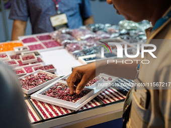 Visitors and exhibitors attend the 70th gems and jewelry fair in Bangkok, Thailand. The trade show is one of the most important events of it...