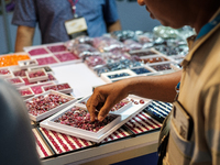 Visitors and exhibitors attend the 70th gems and jewelry fair in Bangkok, Thailand. The trade show is one of the most important events of it...