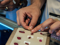 Visitors and exhibitors attend the 70th gems and jewelry fair in Bangkok, Thailand. The trade show is one of the most important events of it...