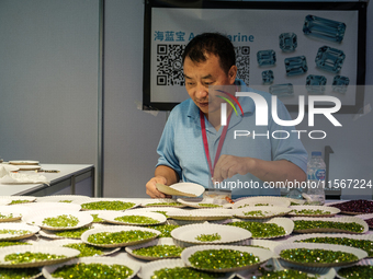 Visitors and exhibitors attend the 70th gems and jewelry fair in Bangkok, Thailand. The trade show is one of the most important events of it...